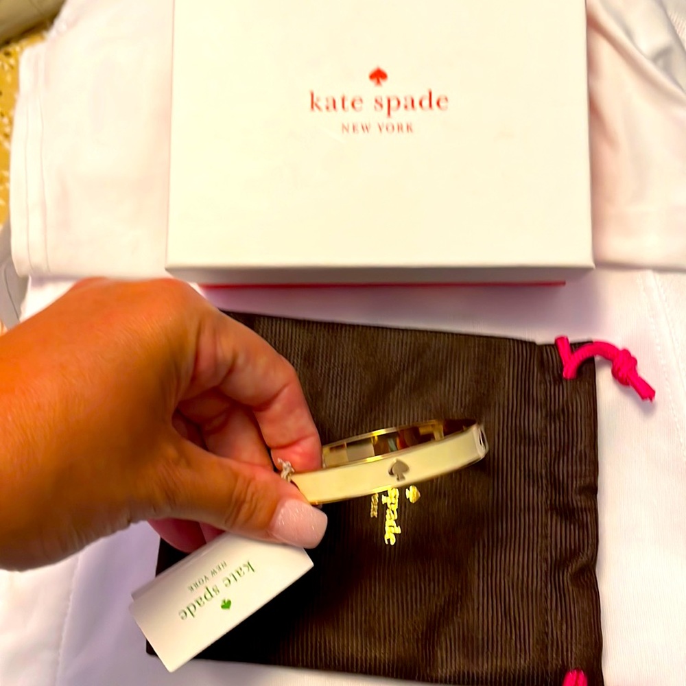 NWT Kate Spade gold bangle bracelet with ivory enamel.